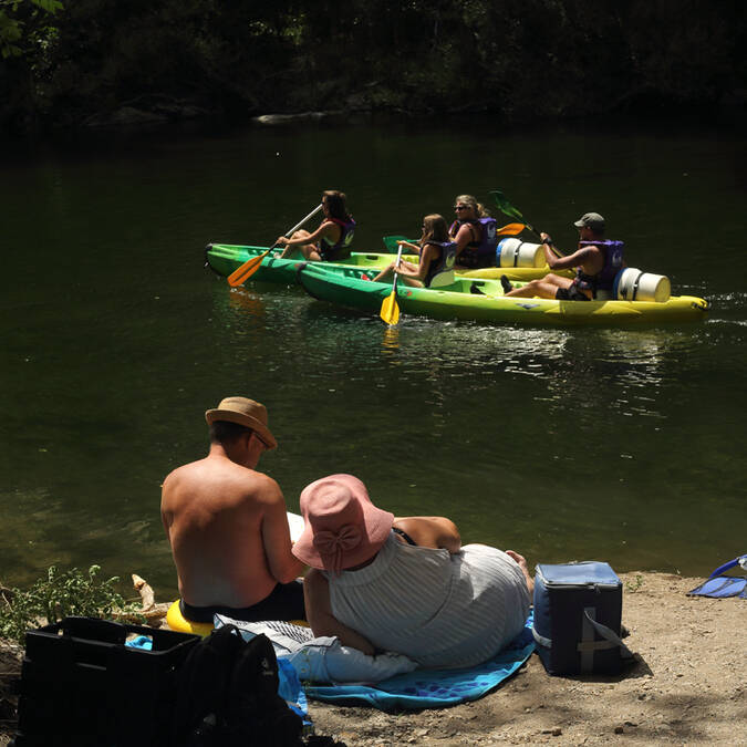 Relaxing by the river Orb, watching the canoeists